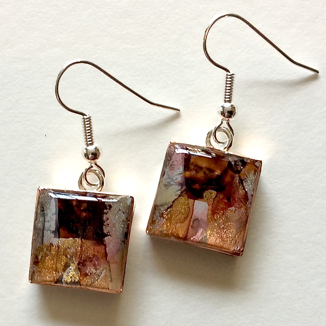A pair of painted rectangular earrings on fine hooks